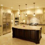 large kitchen island in a classic kitchen with white cabinets