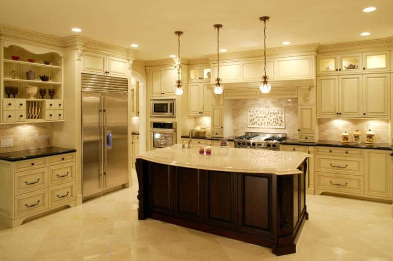 large kitchen island in a classic kitchen with white cabinets