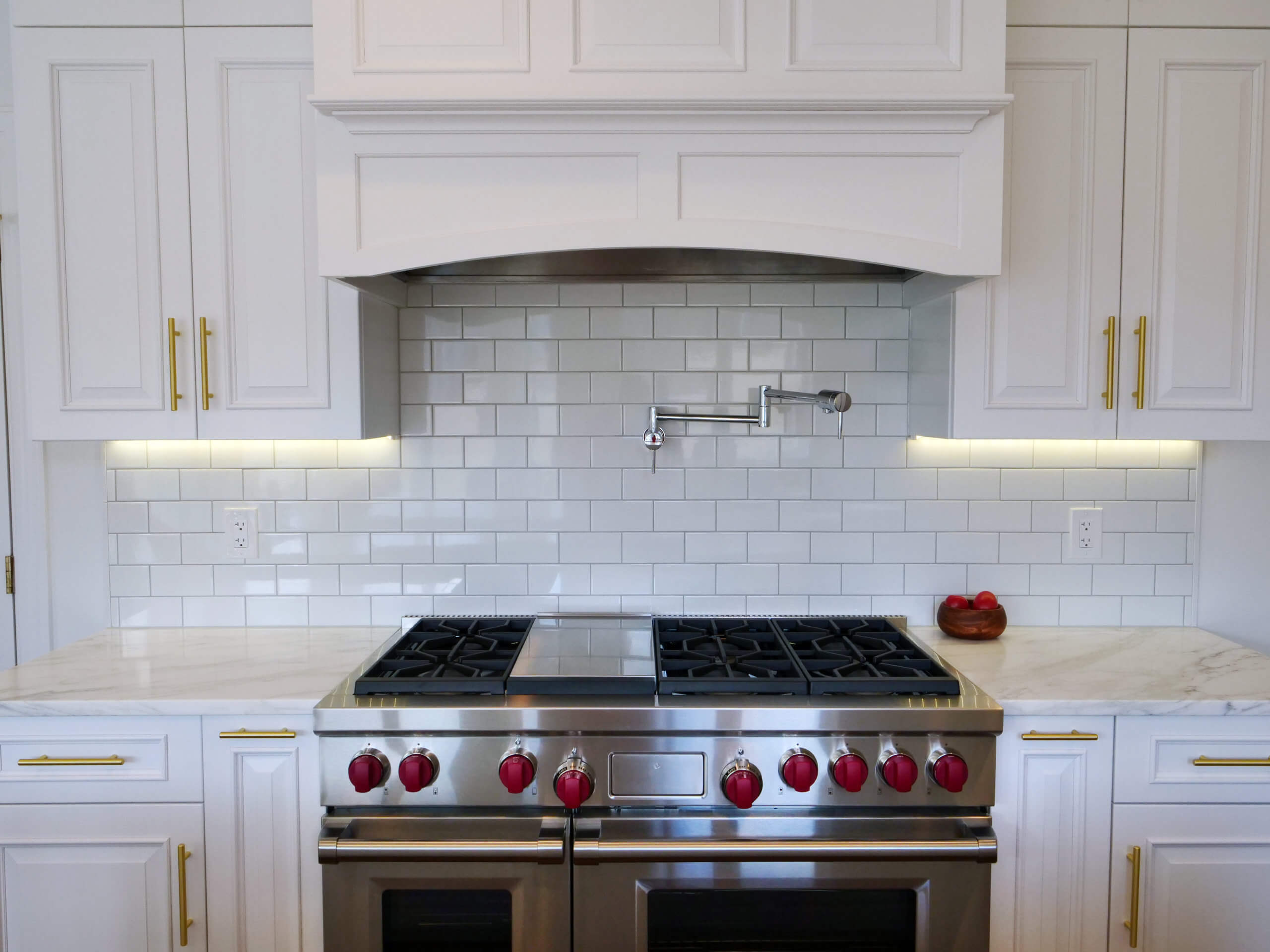 burner and Marble white counters and cabinets in newly remodeled kitchen