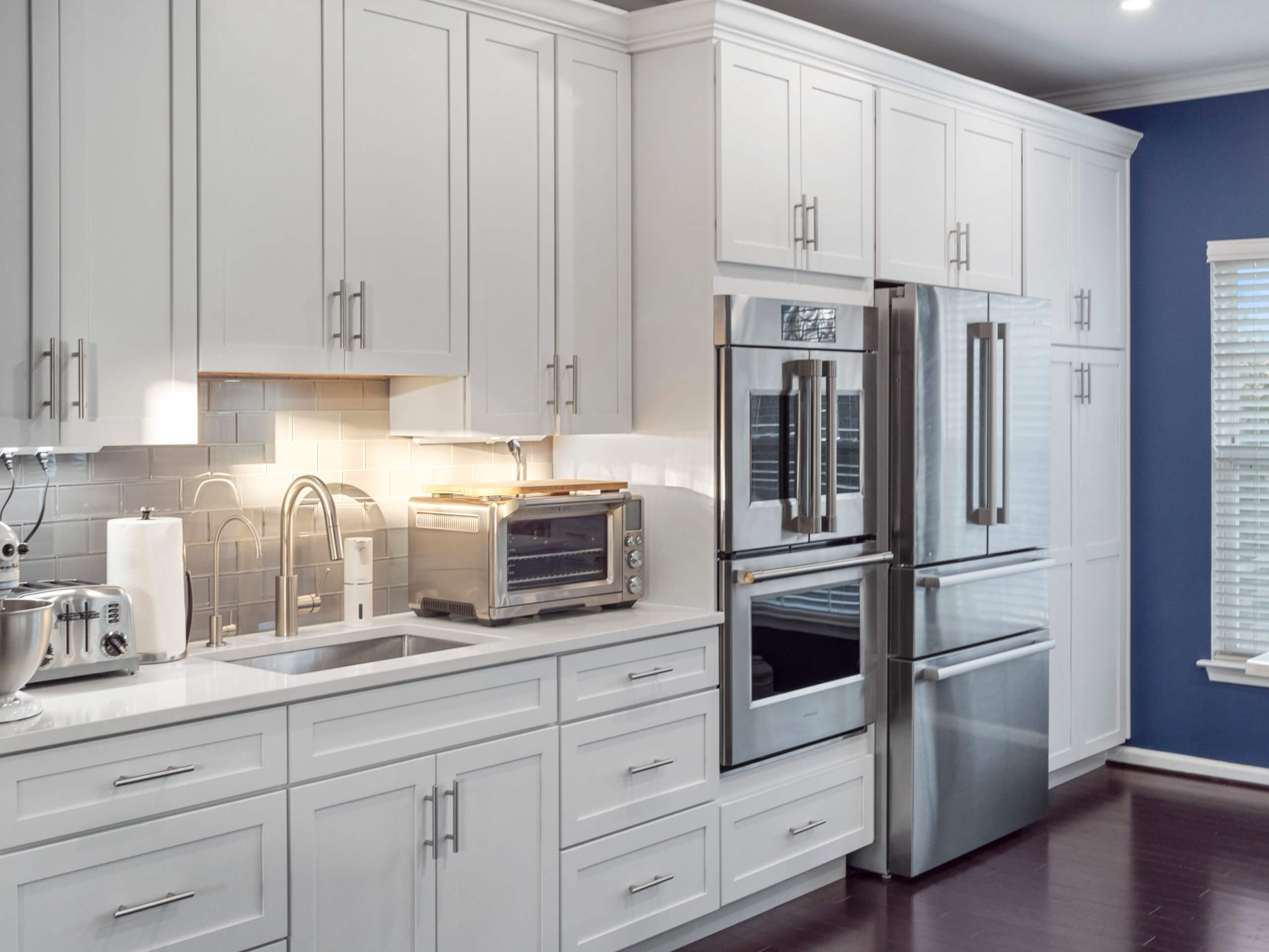 All White Custom Cabinetry with stainless steel appliances