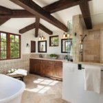 Master bathroom remodel with soaking tub, shower with glass doors and exposed wood beams on ceiling