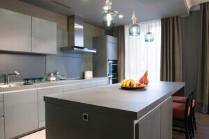 kitchen design with gray cabinets, countertop and walls