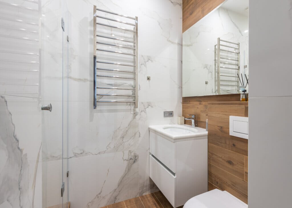 white bathroom vanity with toilet rack