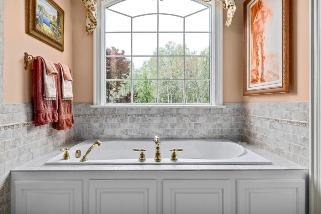 Luxurious bathroom with cotton towels and artwork