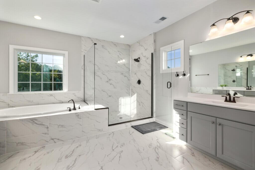 timeless bathroom design in marble tiles and neutral color scheme