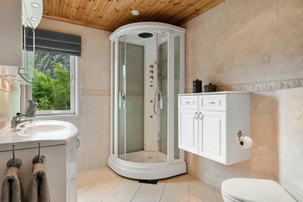 contemporary bathroom with wood paneling ceiling