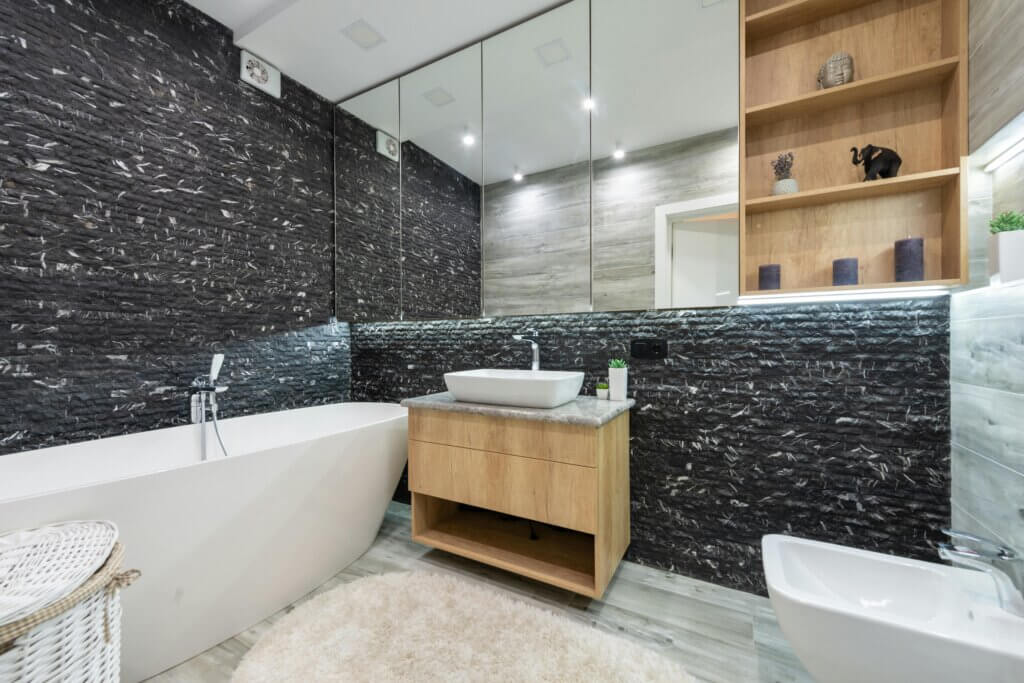 Modern bathroom with built-in cabinets, free standing bath tub and bathroom vanity